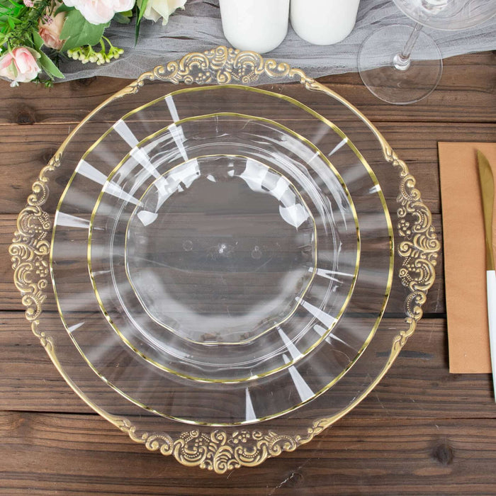 Elegant clear plate set with gold accents on a rustic wooden table.