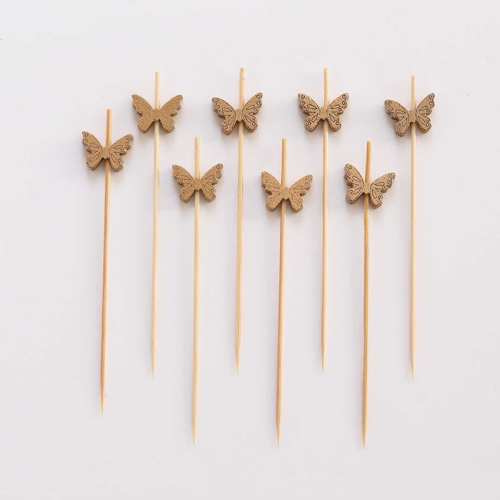 Wooden butterfly cake toppers on skewers for decoration