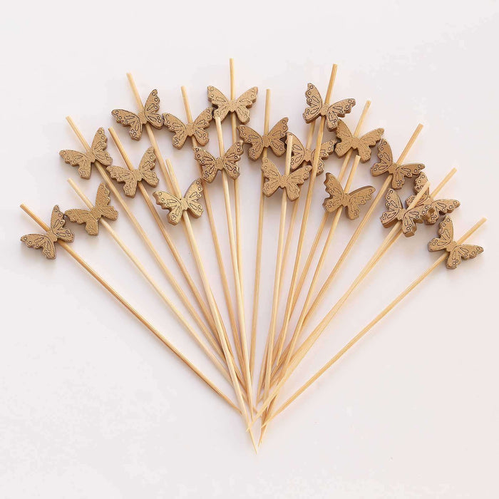 Wooden butterfly cake toppers on sticks arranged in a fan shape