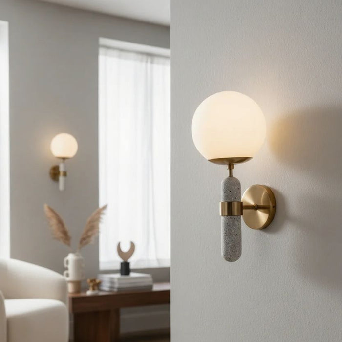 Modern wall satin brass sconces in a living room setting with neutral tones.