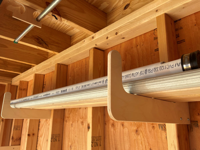 Keep poles organized with this rack. Complete Shed Organization Kit by HangThis Up.