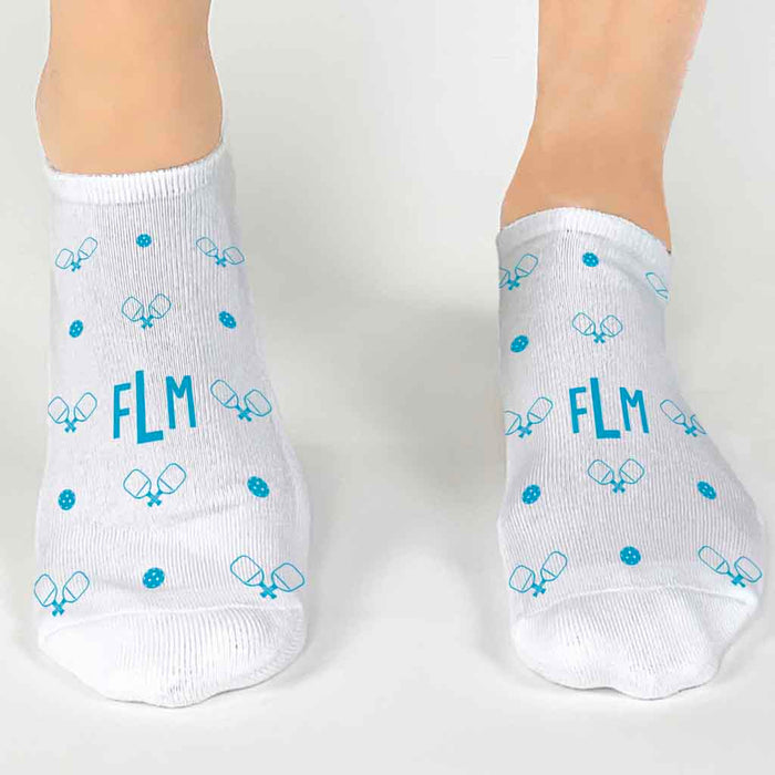 Personalized socks with a pickleball design custom printed on white cotton no show socks.