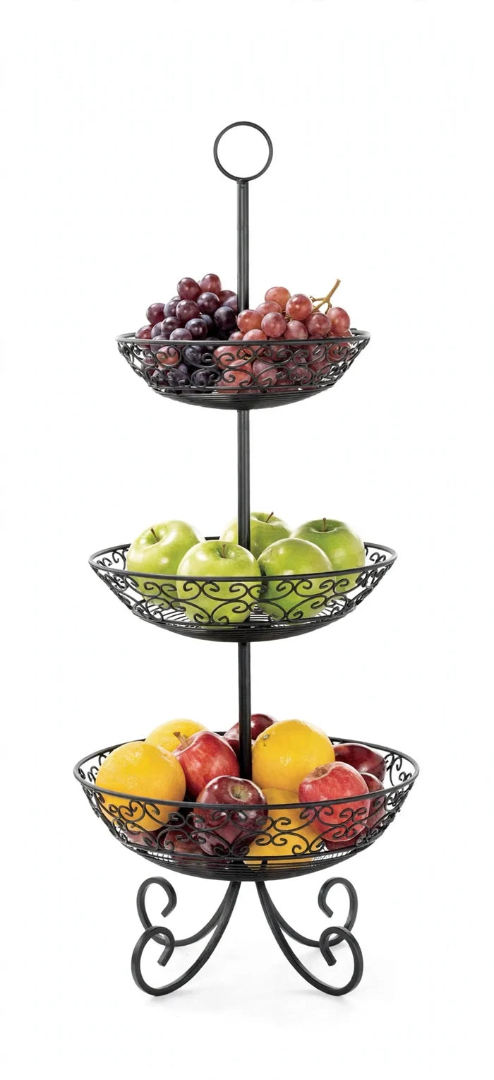 Black three-tier TableCraft display basket with grapes, green apples, red apples and lemons against a white background.
